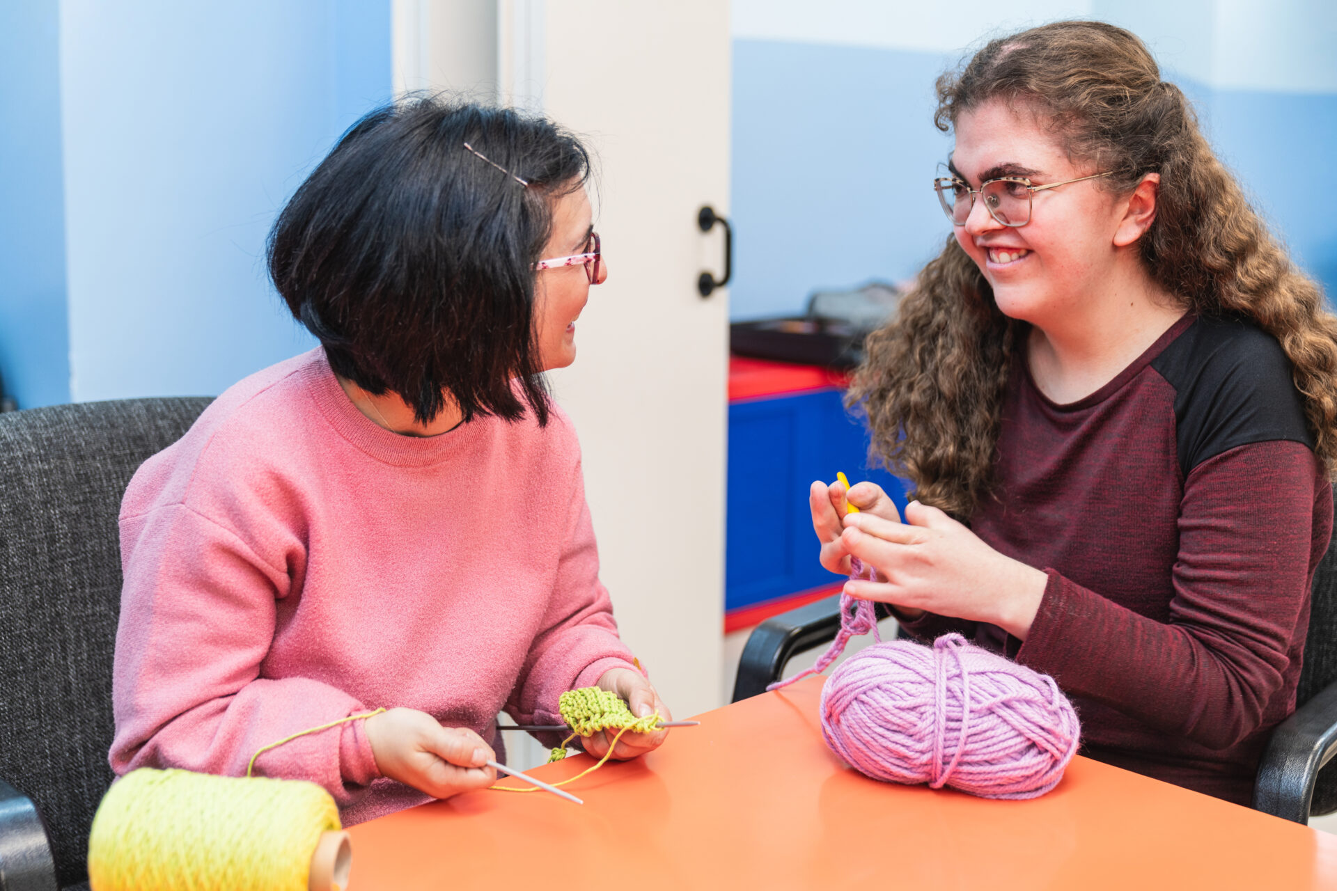 Joyful Interaction During Sewing Class for Disabled Individuals